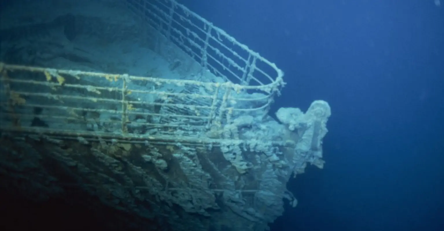 Eerie photos show the Titanic wreckage lying 12,500ft down in the ocean's depths