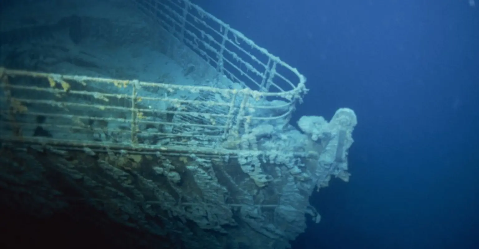 Eerie photos show the Titanic wreckage lying 12,500ft down in the ocean's depths