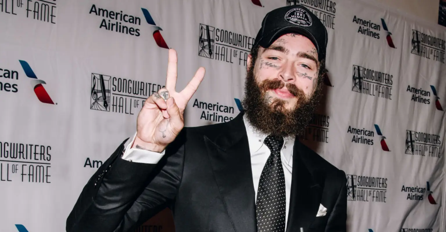 Post Malone cuddles fan who had brain hemorrhage in sweet moment