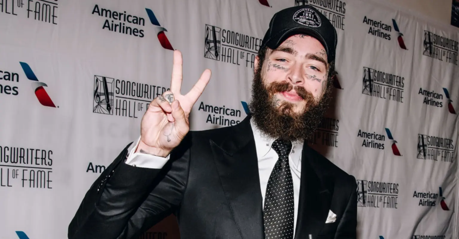 Post Malone cuddles fan who had brain hemorrhage in sweet moment