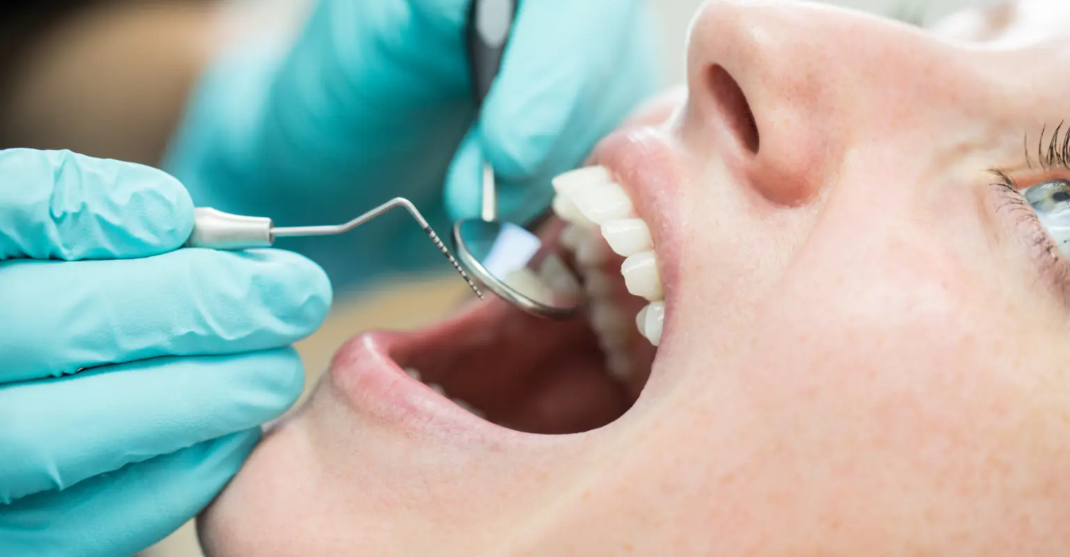 Woman refuses infected tooth removal to stay identical to twin: 'I'll live with the pain'