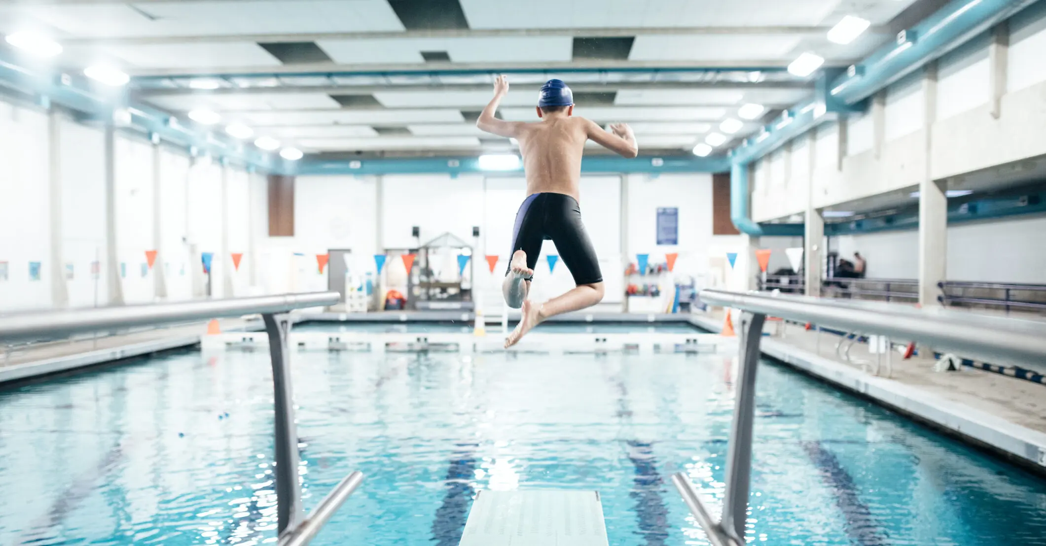 Lifeguard kicks man who's hesitant to jump off diving board