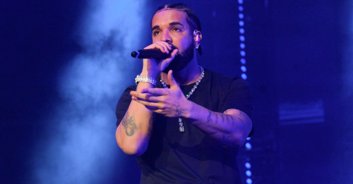 Over-eager fan grabs Drake by the throat as rapper walks through crowd