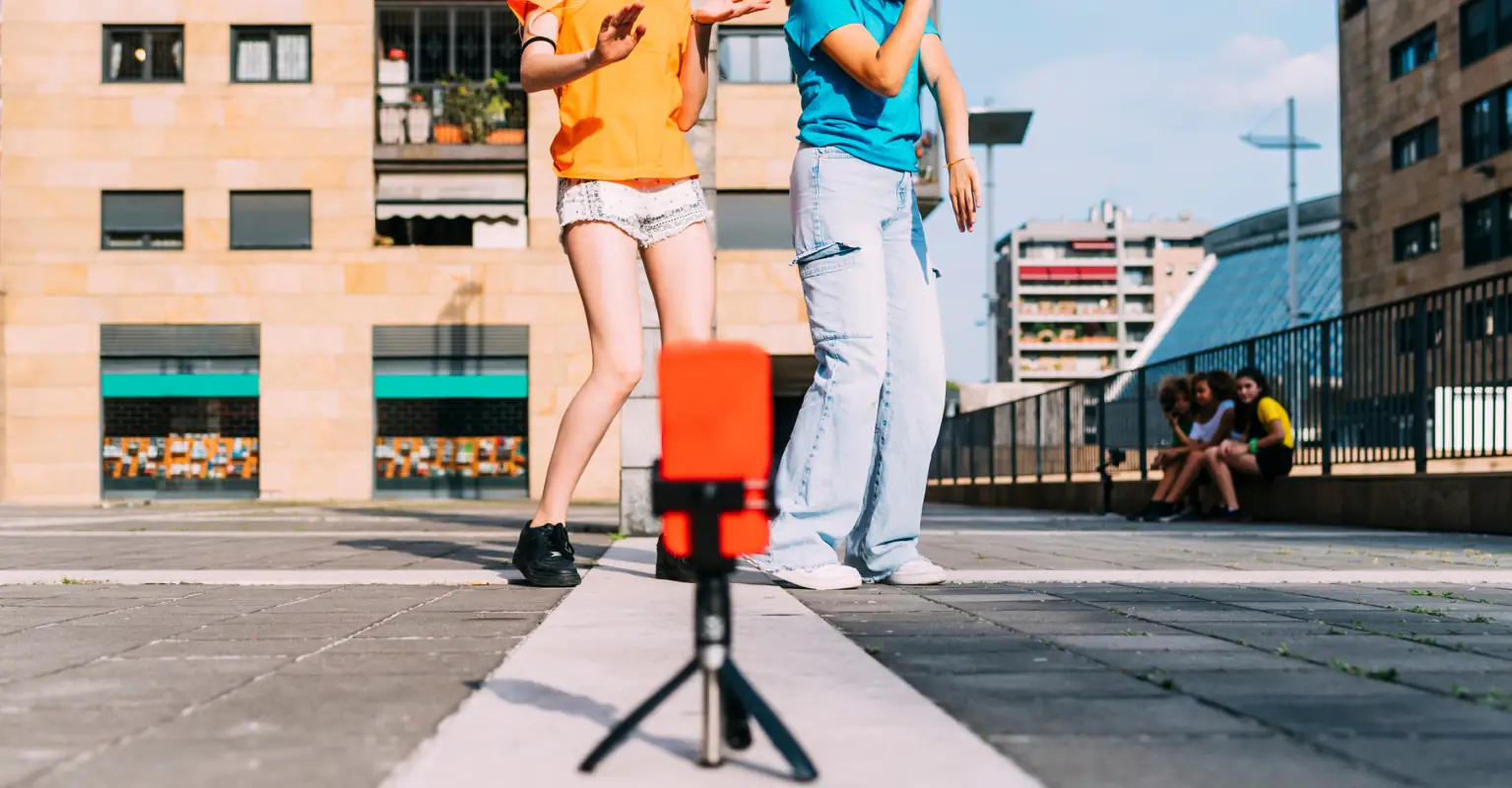 Woman yells at influencers to 'get a real job' as they're taking photos outside