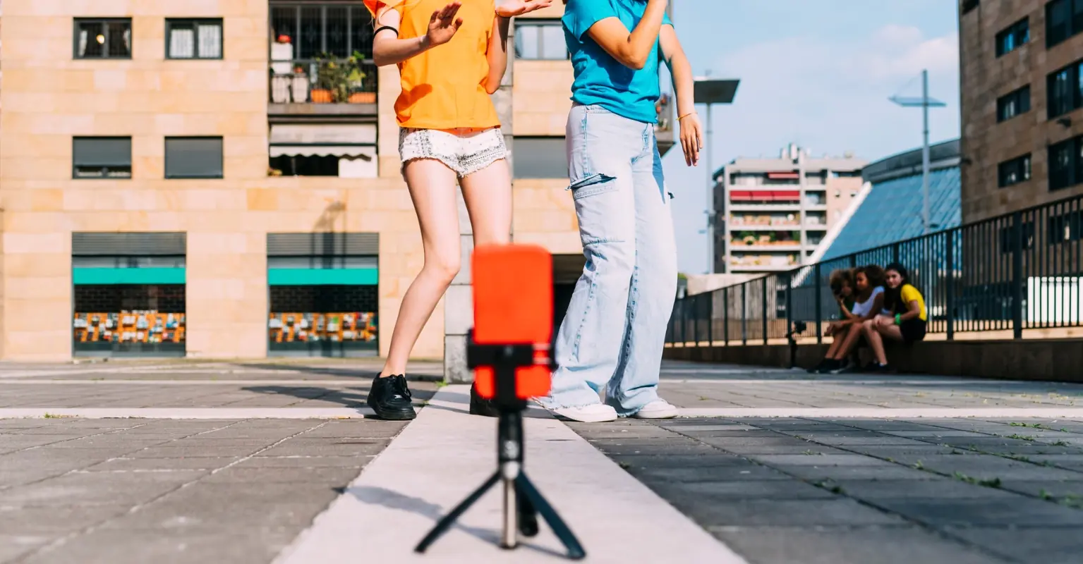 Woman yells at influencers to 'get a real job' as they're taking photos outside