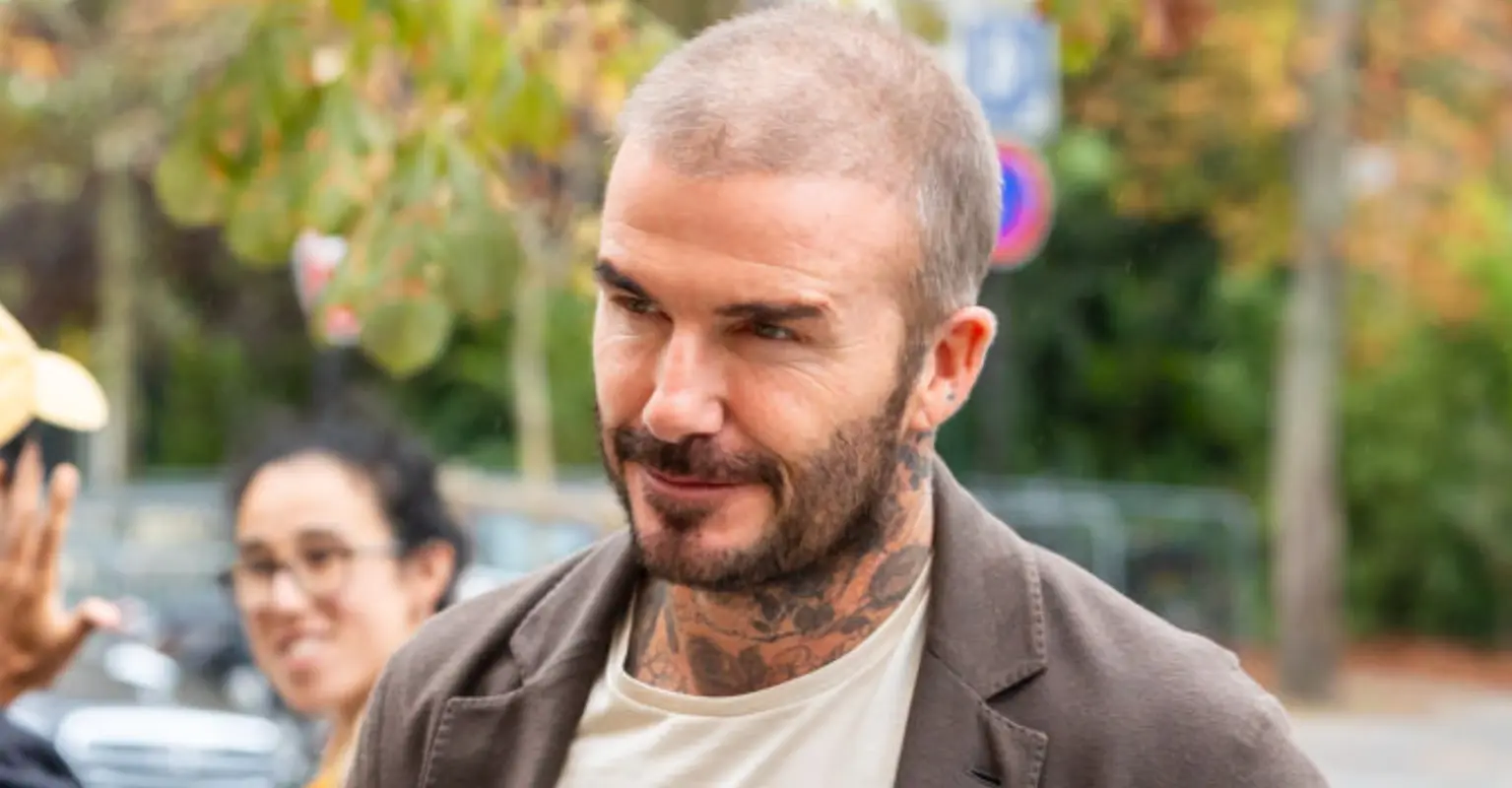 Fans rush to defend David Beckham after he kisses daughter, 12, on the lips