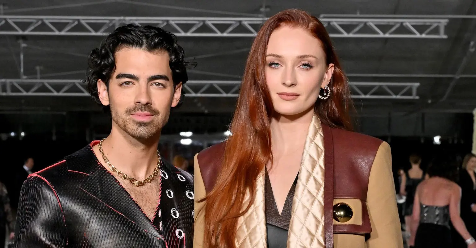 Sophie Turner's fans defend the star for 'doing her job' after photos of her kissing co-star are shared online