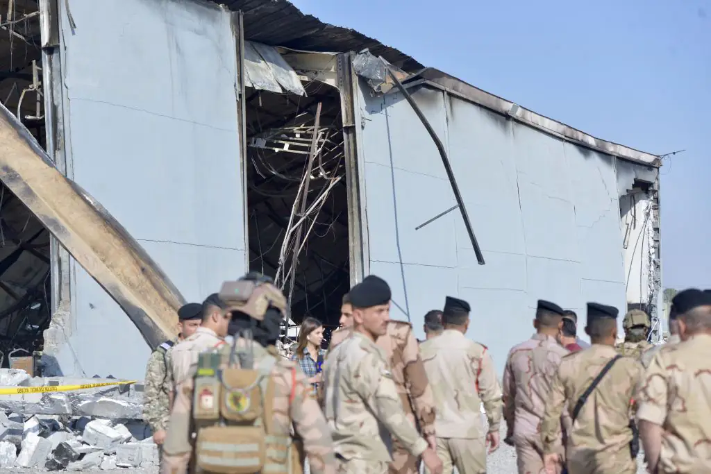 Soldiers are seen in front of the site after a fire broke out at a wedding celebration in the northern Nineveh province. Credit: Ahsan Mohammed Ahmed Ahmed/Anadolu Agency/Getty
