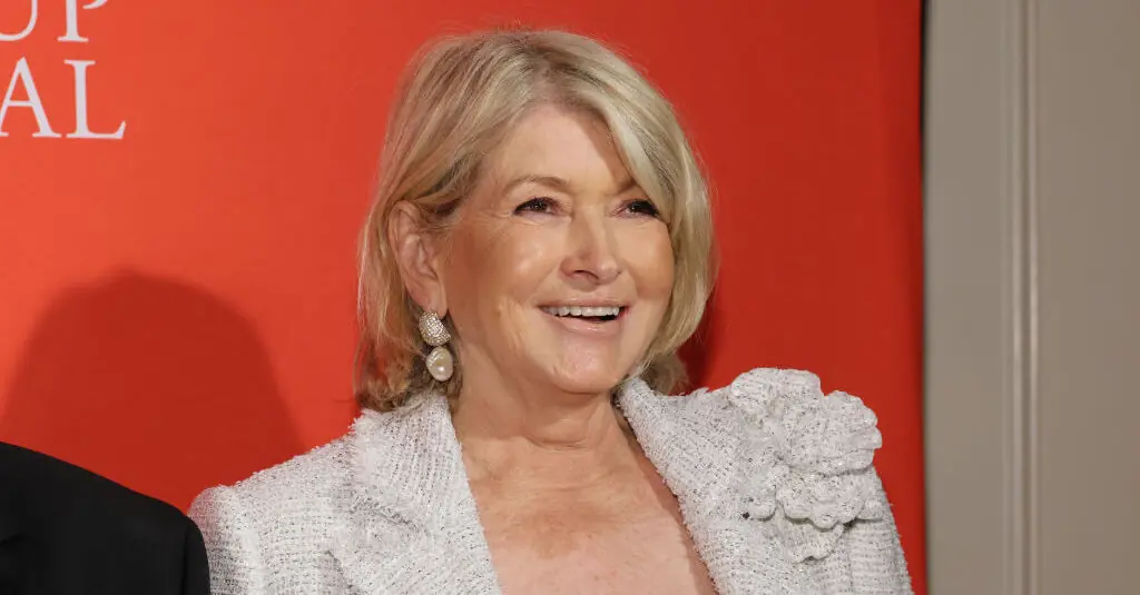 Fans are calling Martha Stewart, 82, 'just too hot' as she poses in stunning thigh-high split dress