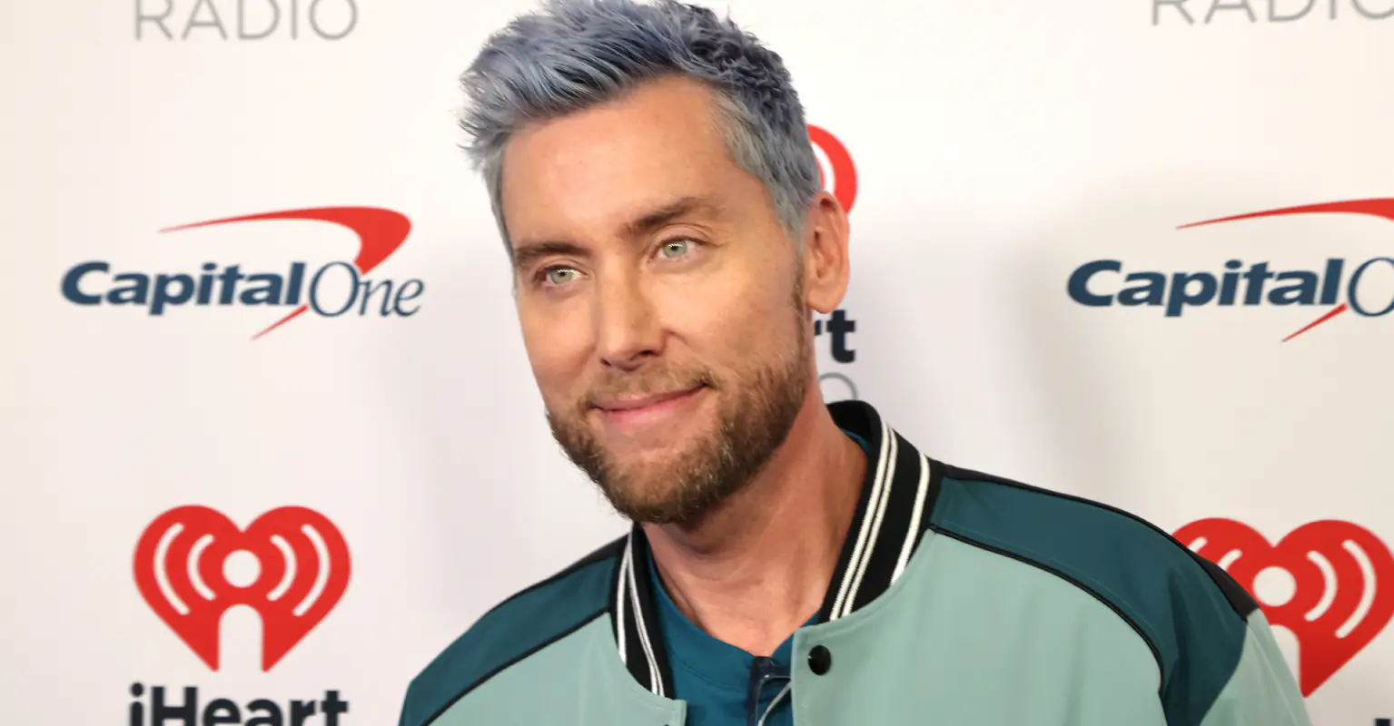 NSYNC's Lance Bass trolls the NFL with 'not Taylor Swift' sign during game