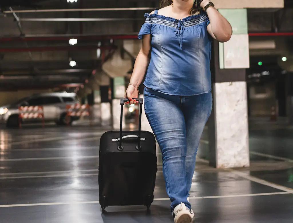 woman pulling suitcase 