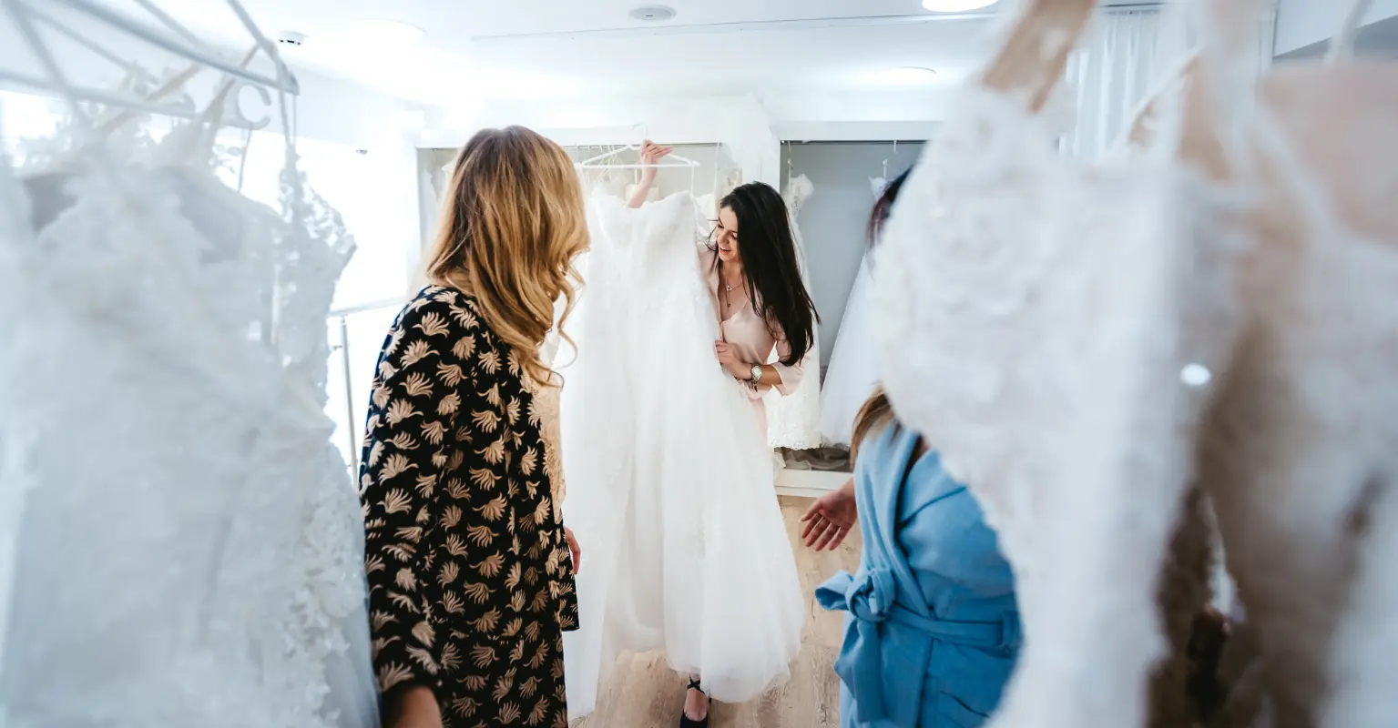 Woman sparks debate after calling out bridal store for adding a tip on her wedding dress