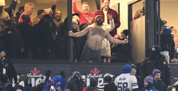 Jason Kelce steals attention away from Taylor Swift as he chugs beers with fans and rips off shirt