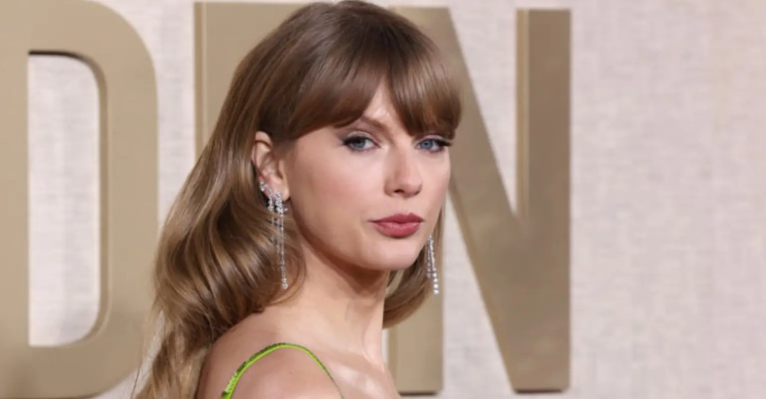 Taylor Swift looks very unimpressed after Golden Globes host Jo Koy makes NFL dig