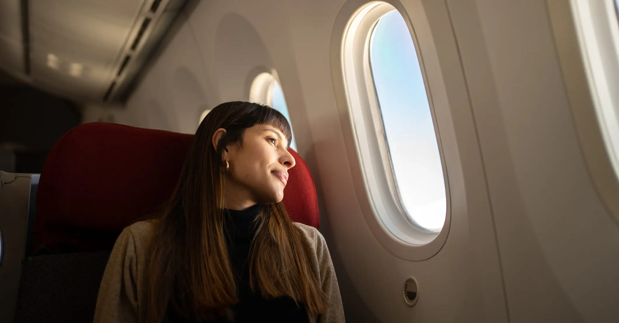 Flight attendant reveals the truth behind the black triangle stickers inside planes