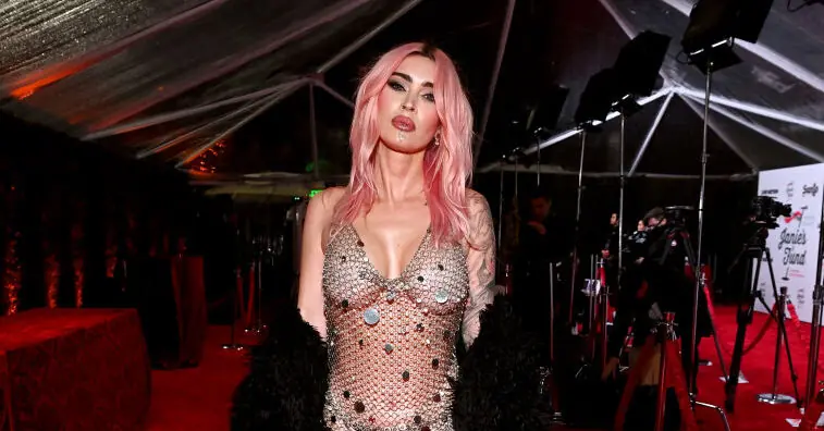 Megan Fox unveils huge new tattoo and pink hair as she stuns in see-through dress at Grammys viewing party