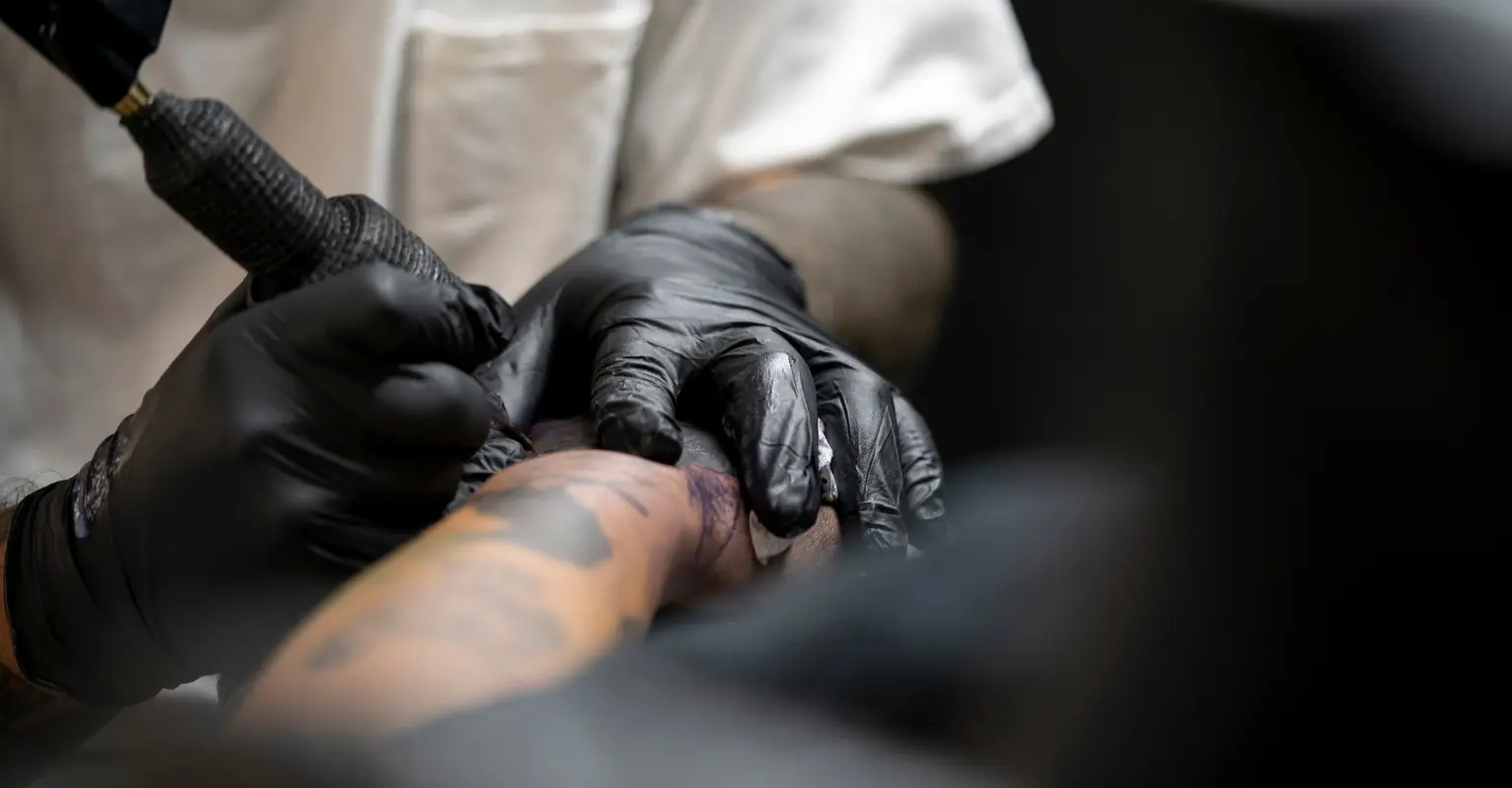 Machine Gun Kelly shows off outrageous black-out tattoo covering most of his torso