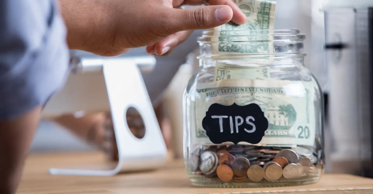 Coffee shop staff divided as owner bans tipping and gives them a huge payrise instead