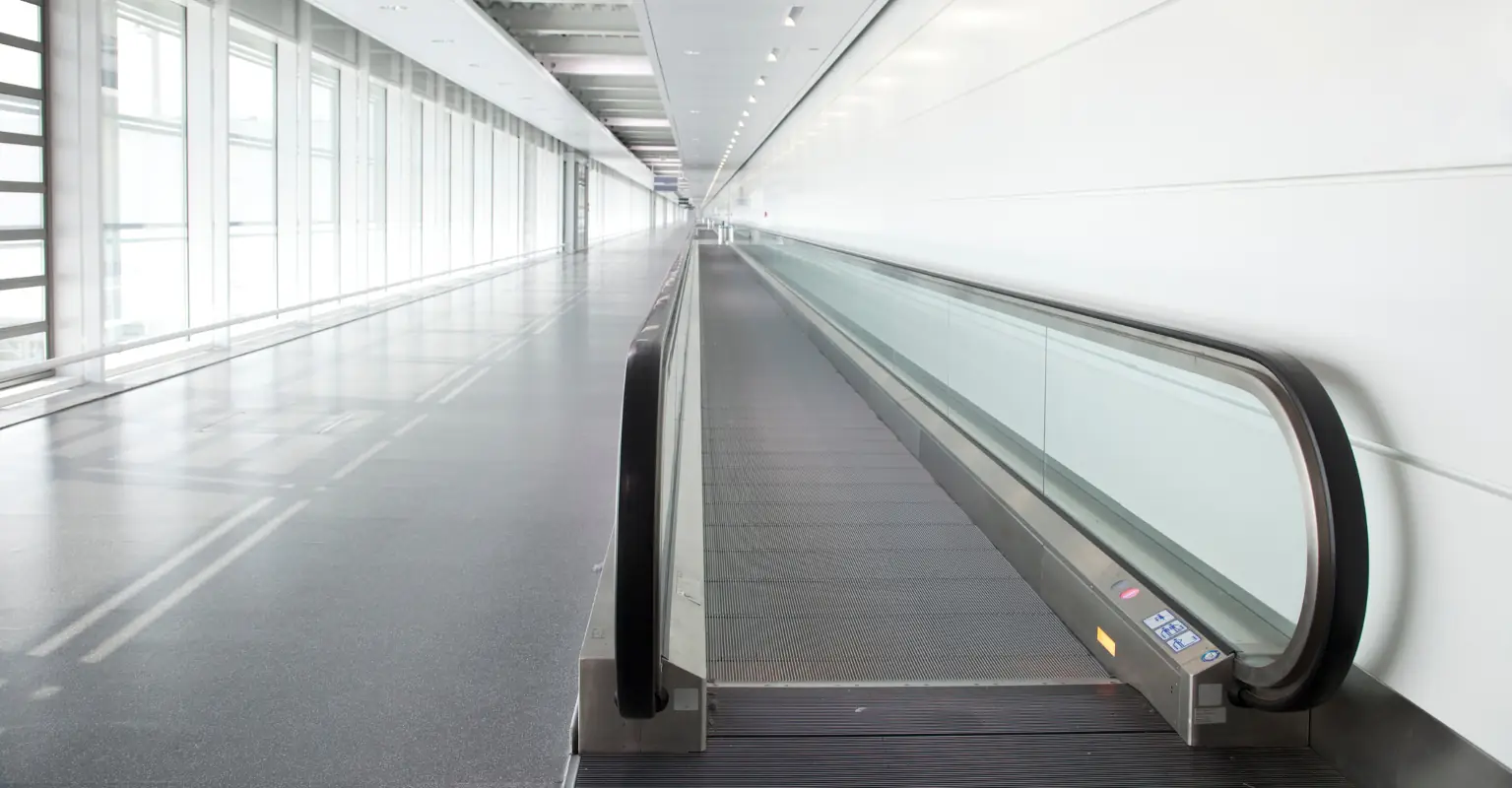 Terrifying moment a Delta pilot's foot is 'swallowed' by airport's moving walkway