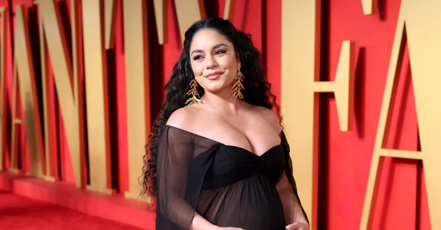 Vanessa Hudgens flaunts baby bump in sheer gown at 2024 Vanity Fair Oscars afterparty