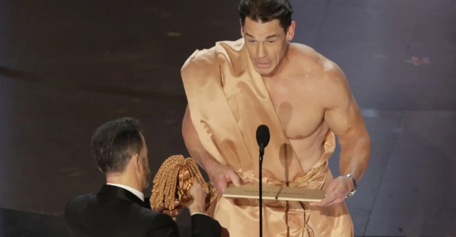 Behind-the-scenes video shows the moment a naked John Cena was swiftly covered up off-air