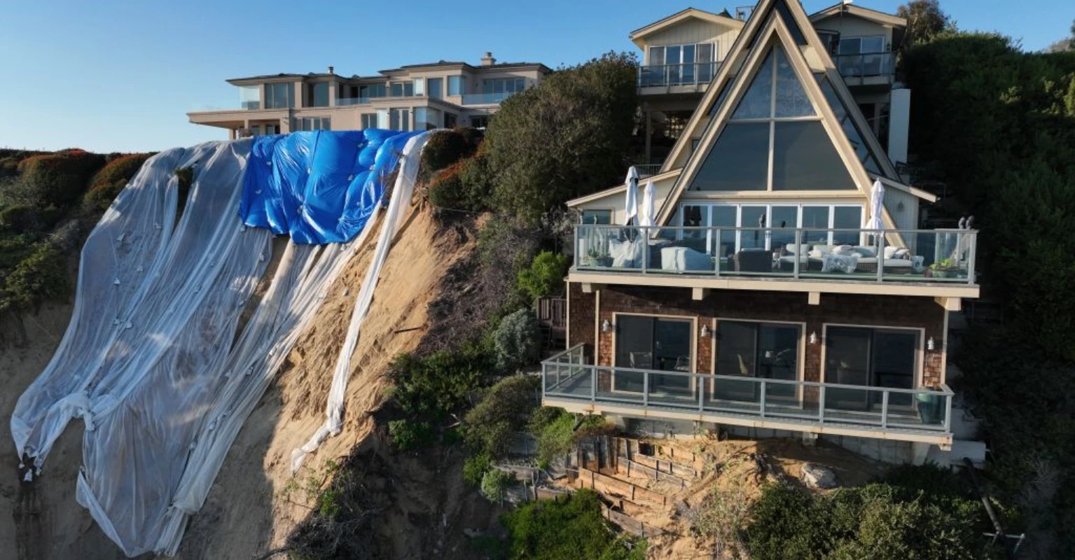 California homeowner 'checks his house every hour' after multi-million dollar mansion is left teetering on edge of cliff by landslides