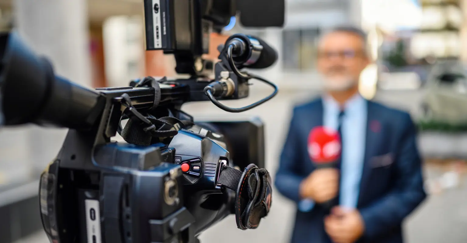 Newsreader's report is interrupted by angry bird repeatedly hitting her in the head
