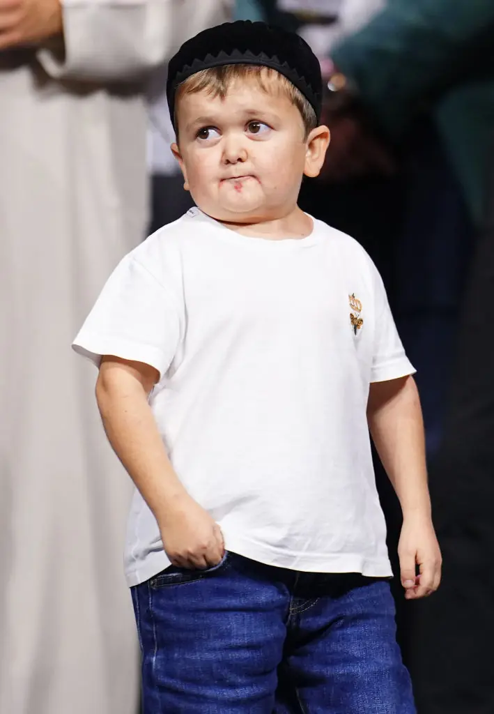 Bizarre footage shows Mike Tyson cradling Hasbulla like a baby and appearing to 'nibble' his ear - Article Image 2