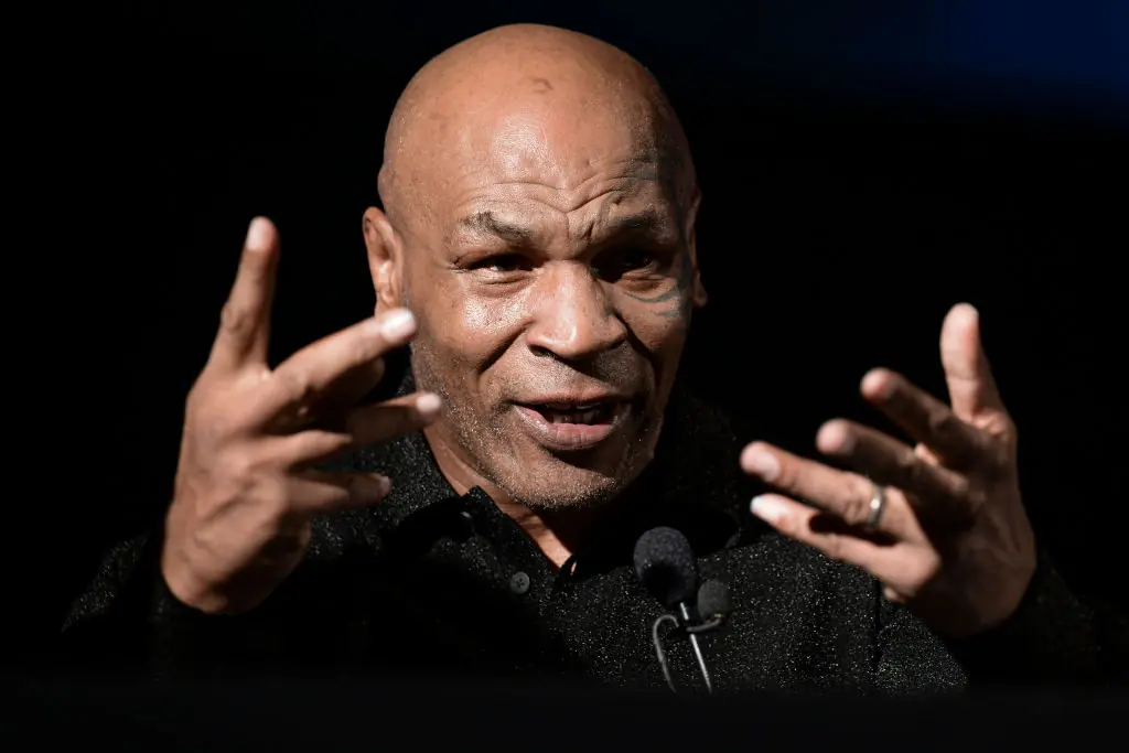 Bizarre footage shows Mike Tyson cradling Hasbulla like a baby and appearing to 'nibble' his ear - Article Image 1
