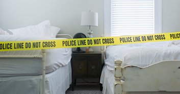Man arrested after his mother is found 'fused' to maggot-infested bed