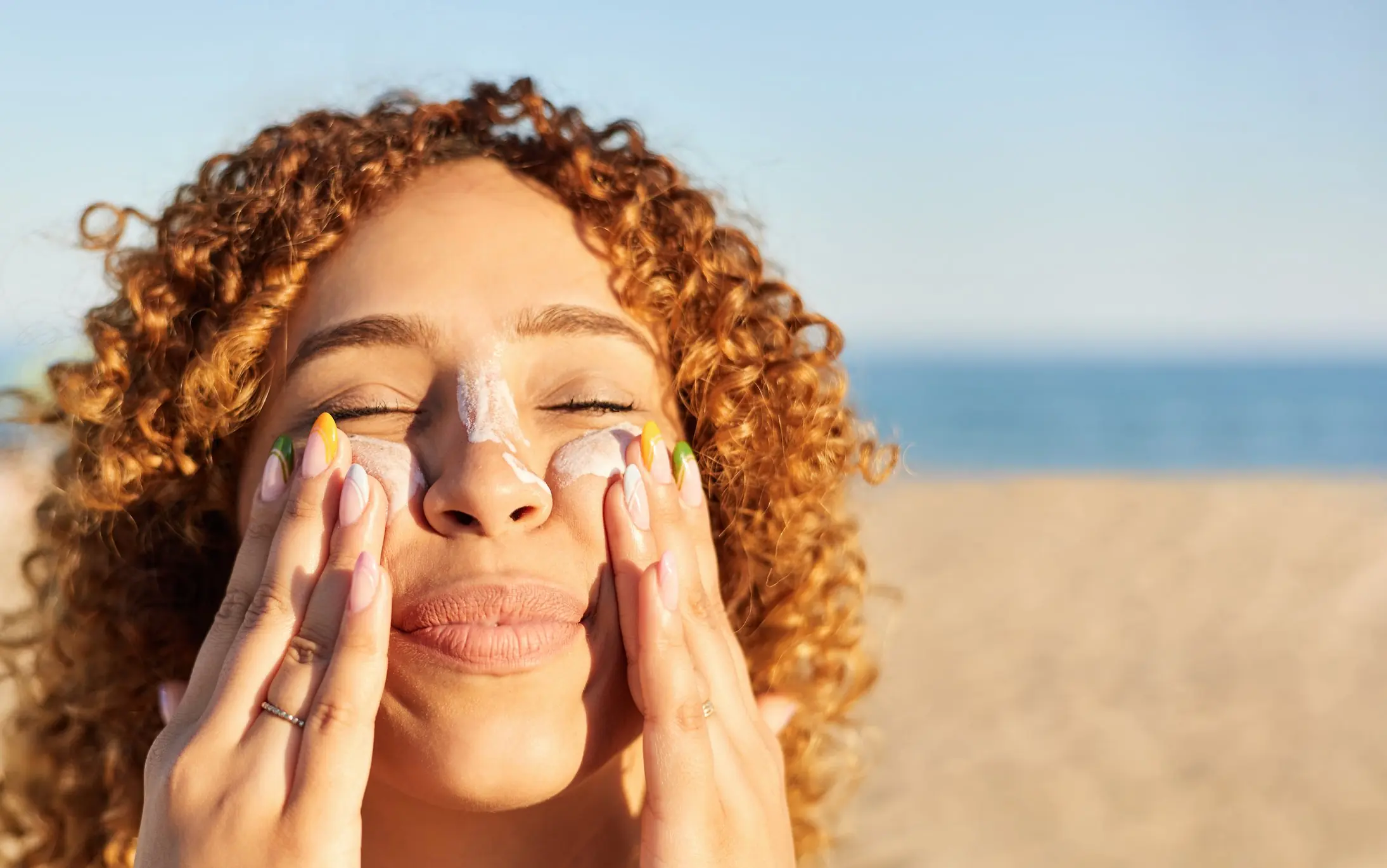 Practice sun safety and keep a close eye on any changes in freckles or moles. Credit: Javi Sanz / Getty