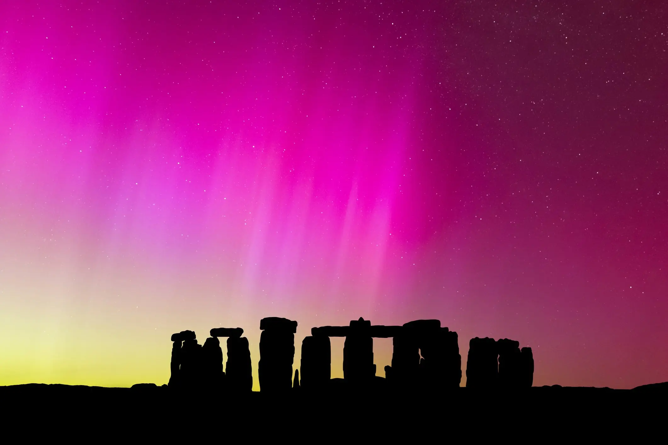 The Northern Lights over Stonehenge, England. Credit: Anton Petrus/Getty