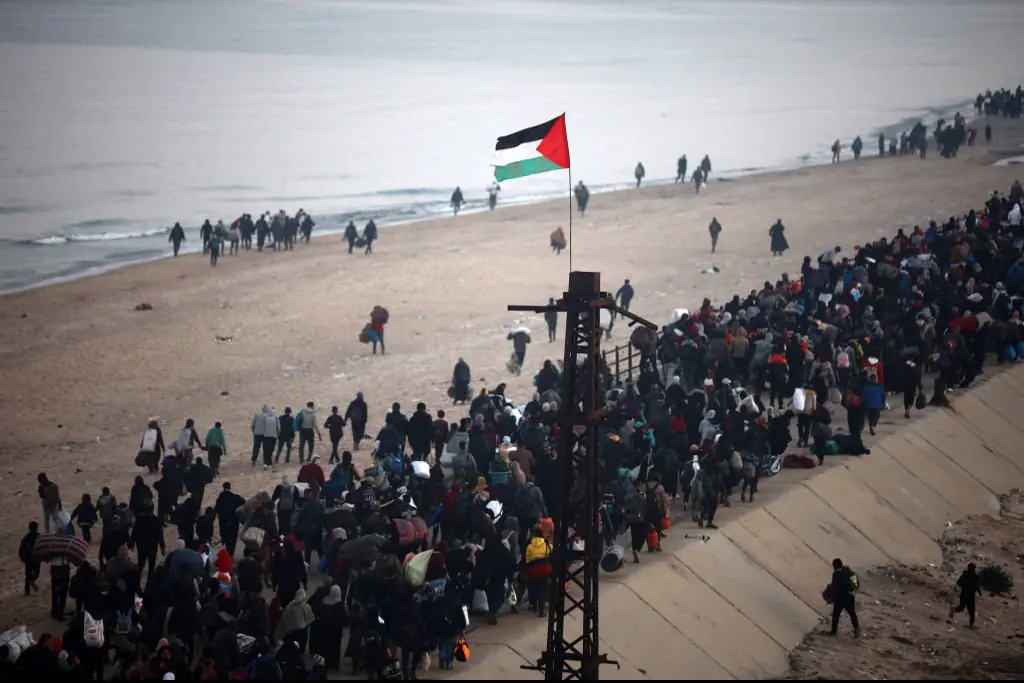 Palestinians, who were displaced to the south at Israel's order during the attacks, make their way back to their homes in northern Gaza after a ceasefire deal. Credit: NurPhoto / Getty