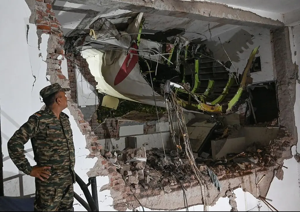 Rescue personnel looking at the wreckage at the site of the Air India flight crash on June 12, 2025 in Ahmedabad, India.Credit: Hindustan Times / Getty