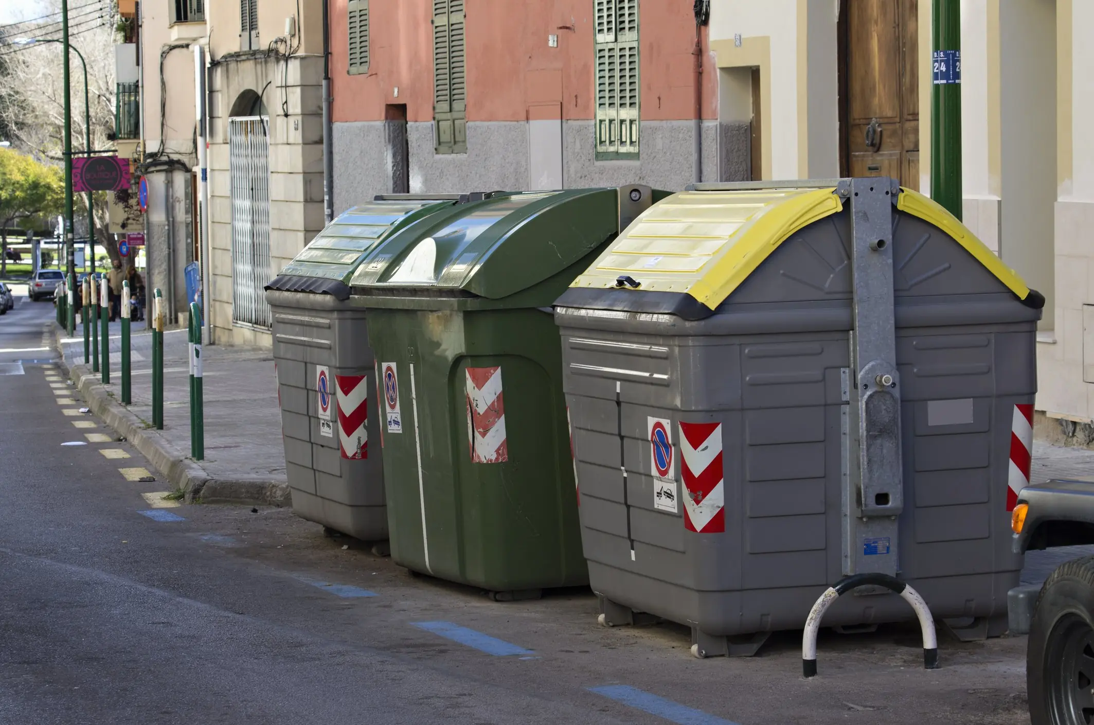 Trash containers on a street in Palma. Credit: Driendl Group / Getty (Stock photo)