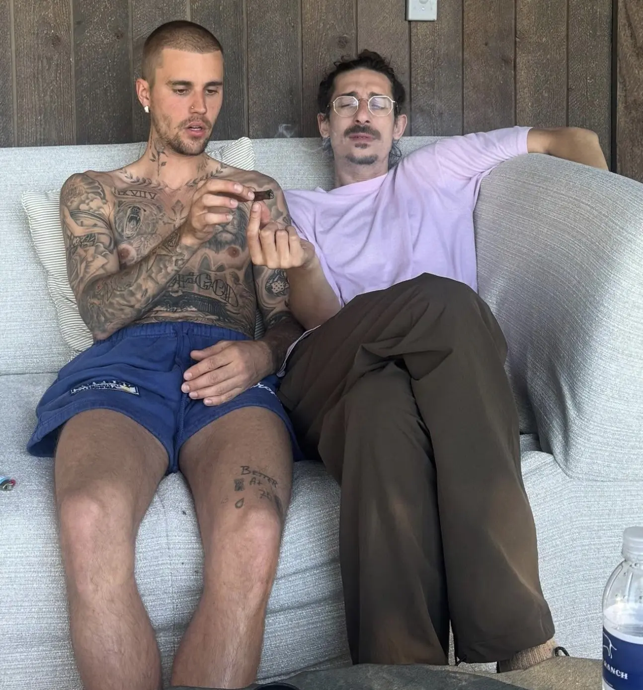  But fans voiced concerns after Bieber shared another photo of him wearing the same outfit, holding a rolled-up cigarette. Credit: Instagram/justinbieber