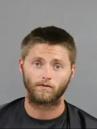 Justin Bearden, 24, and his wife were each charged with two counts of unlawful conduct towards a child. Credit: Anderson County Sheriff's Office SC