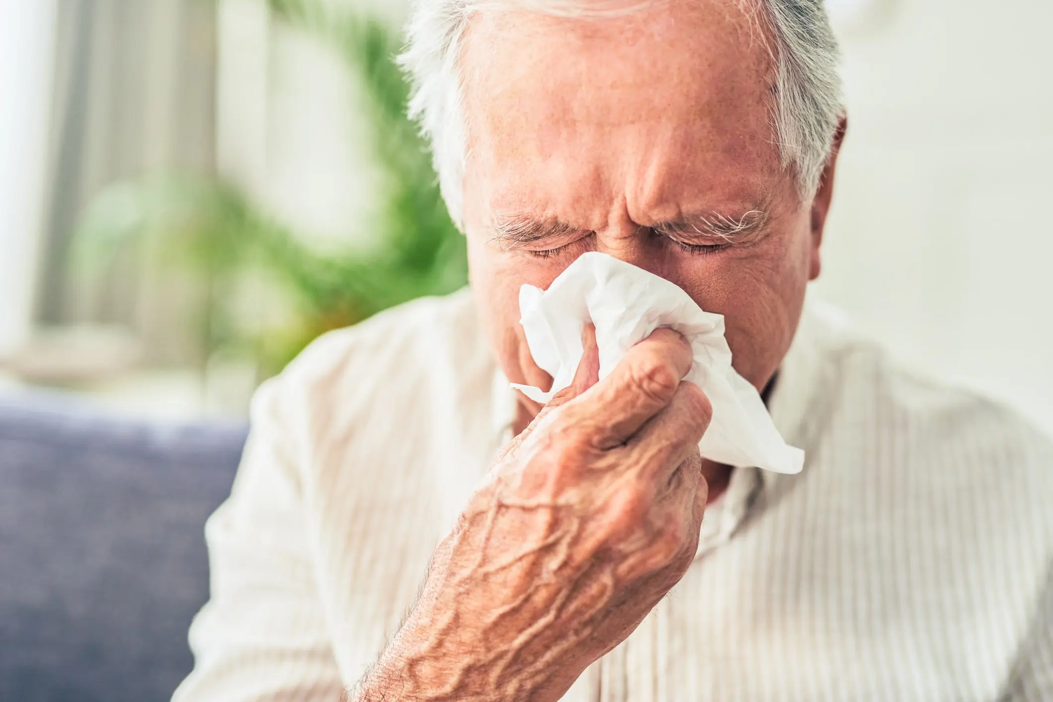 The man sneezed and coughed at the same time. Credit: Moyo Studio/Getty