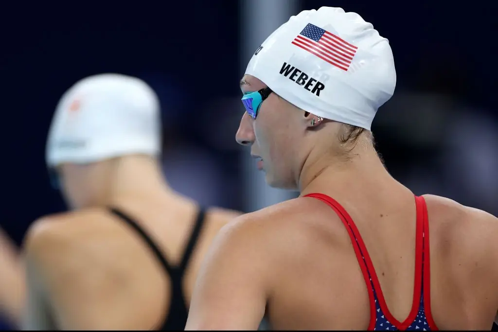Emma Weber lost her cap in the pool, but luckily, the cap catcher was ready. Credit: Sarah Stier/Getty