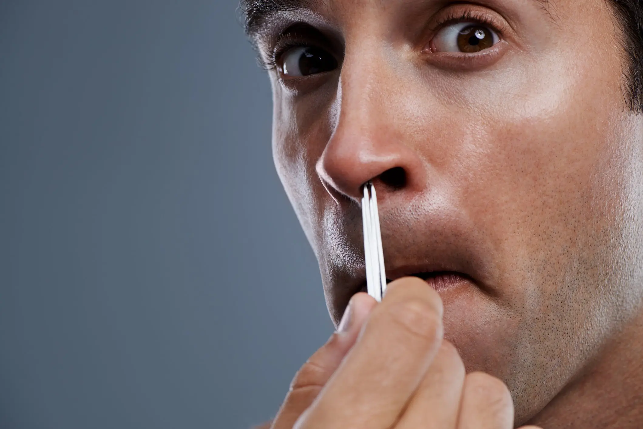 It turns out that using a tweezer for nose hair isn't advised! Credit: PeopleImages/Getty