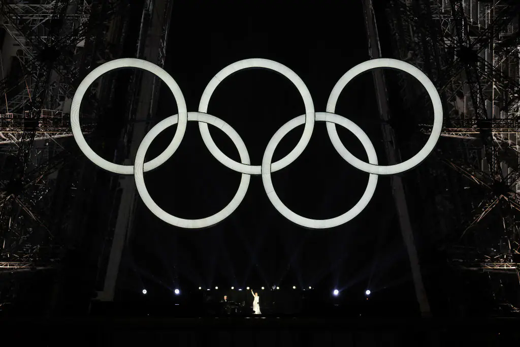 Celine Dion performs on the Eiffel Tower at the conclusion of the opening ceremony of the Olympic Games. Credit: Pascal Le Segretain/Getty