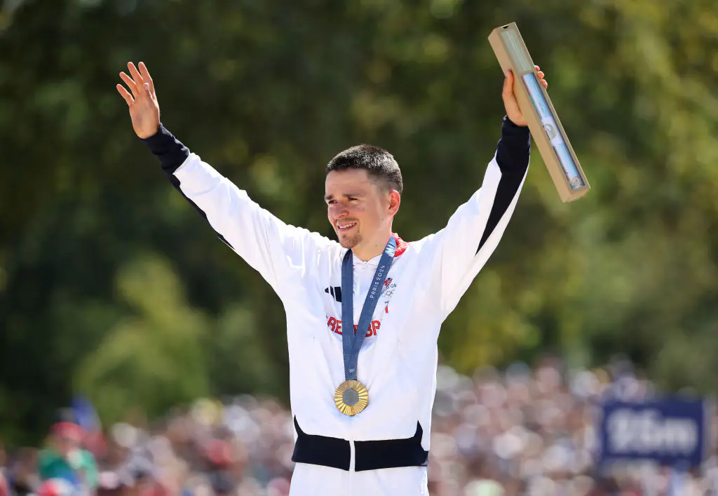 Gold medalist Thomas Pidcock poses with his medal and box. Credit: Jared C. Tilton / Getty
