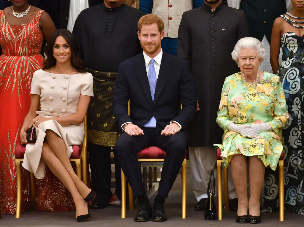 Meghan, Duchess of Sussex, Prince Harry, Duke of Sussex and Queen Elizabeth II at the Queen's Young Leaders Awards Ceremony at Buckingham Palace back in 2018. Credit: John Stillwell - WPA Pool/Getty