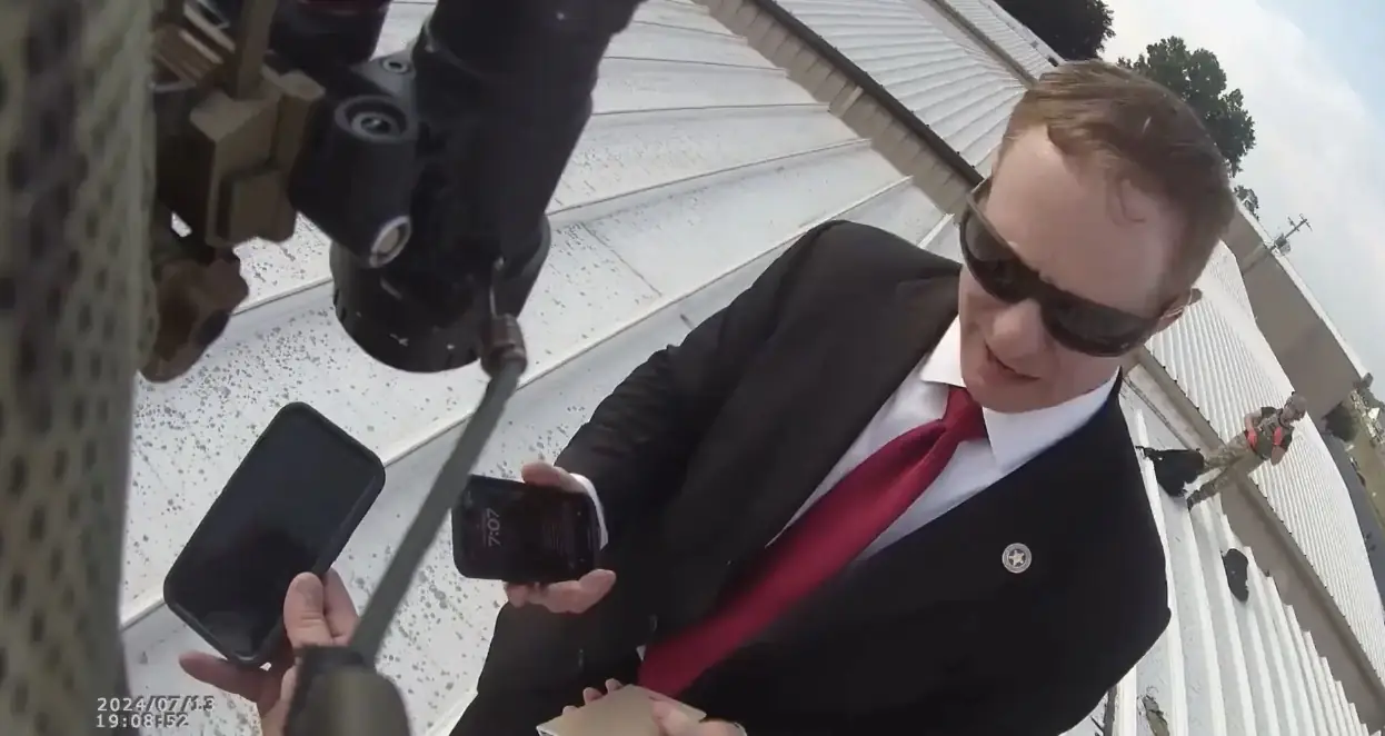 Graphic bodycam footage of Trump's would-be assassin lying dead appears to prove Secret Services had flagged him earlier in the day