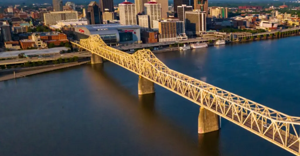 Woman left hanging from bridge 75ft over river after terrifying crash, footage shows