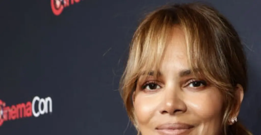Halle Berry accidentally flashes fans in hilarious video of her trying to remove super-tight dress