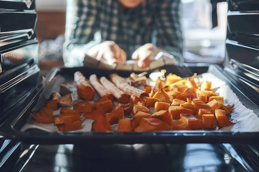 Lewis said an oven can be more effective when cooking a large amount of food at once. Credit: GMVozd / Getty