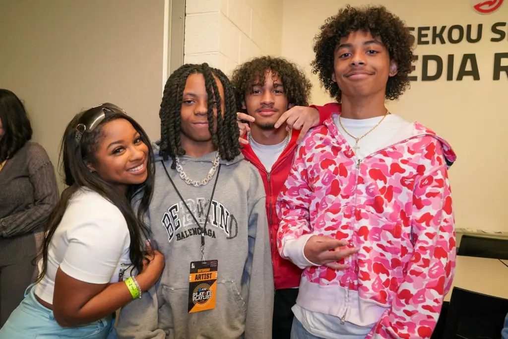 Reginae Carter, Neal Carter, Dwayne Carter III, and Kameron Carter at their father's performance during the AT&T Playoff Playlist Live! concert. Credit: Julia Beverly / Getty Images