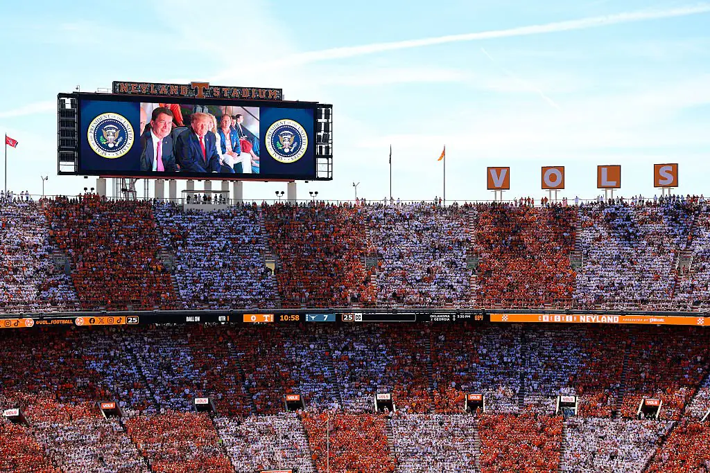Trump appeared on a video screen while attending the Texas-Tennessee football game. Credit: Tom Brenner / Getty
