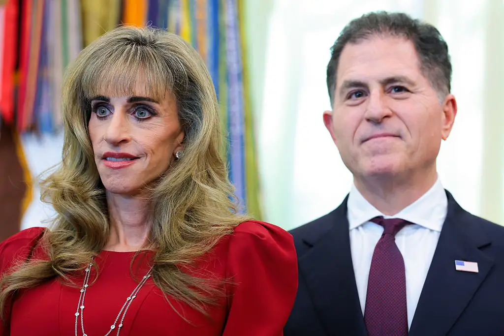 Dell Technologies CEO Michael Dell with his wife Susan, who was dubbed the woman in the red dress. Credit: Anna Moneymaker / Getty